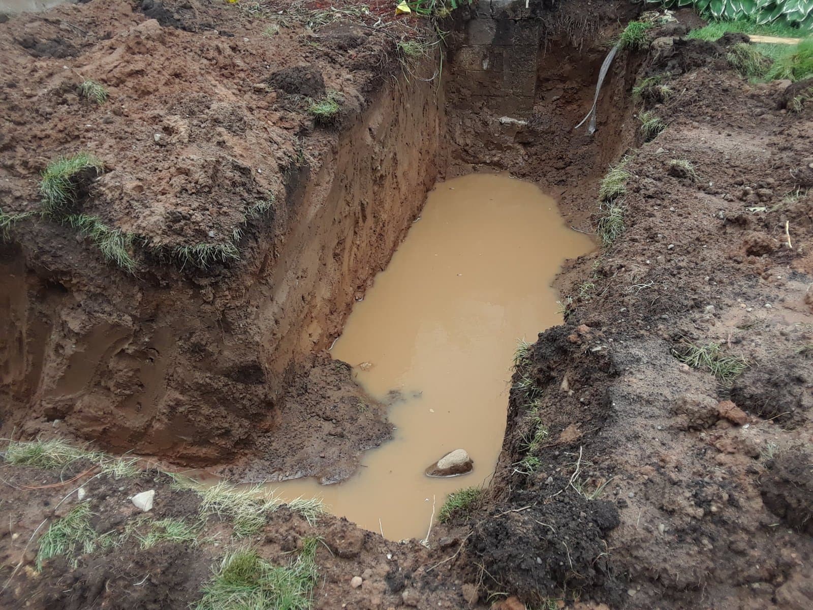 Footing trench against the existing foundation