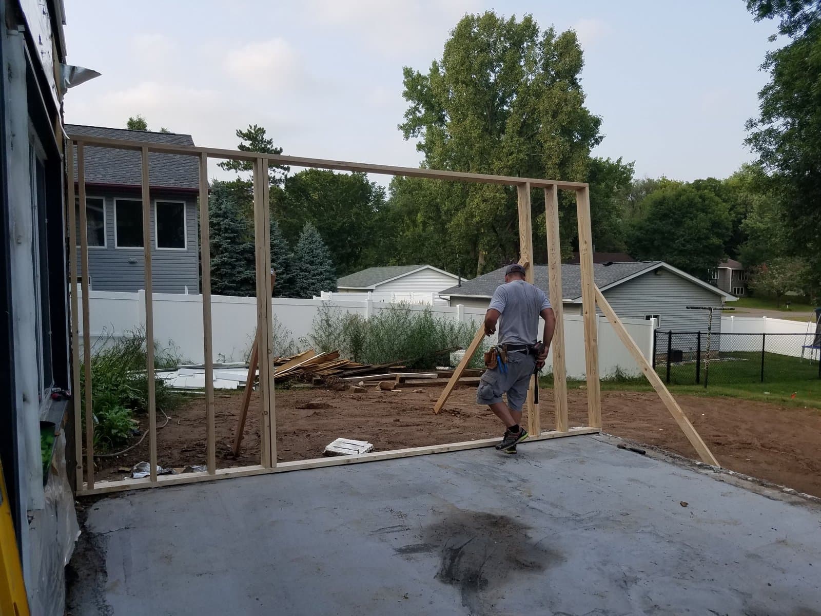 Slab poured and the first wall standing, late August