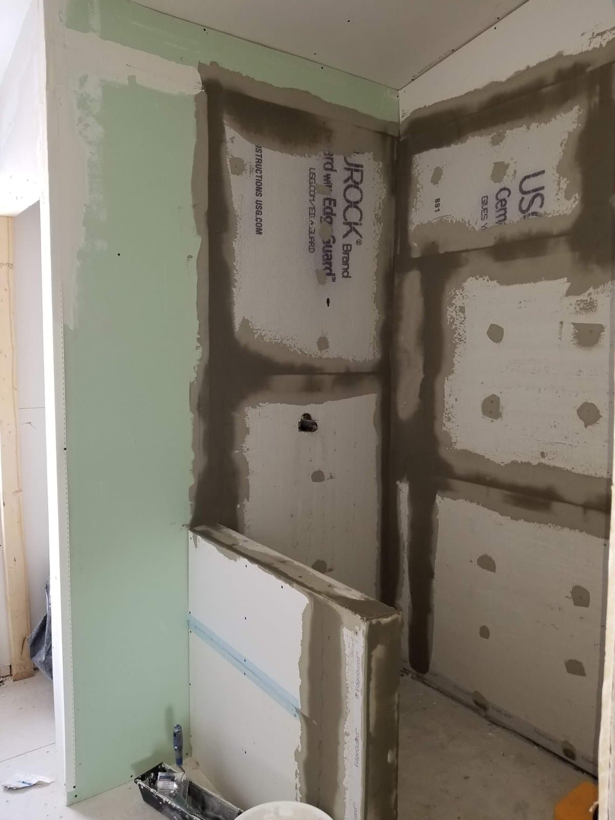 Cement board and plumbing rough-in for the master shower