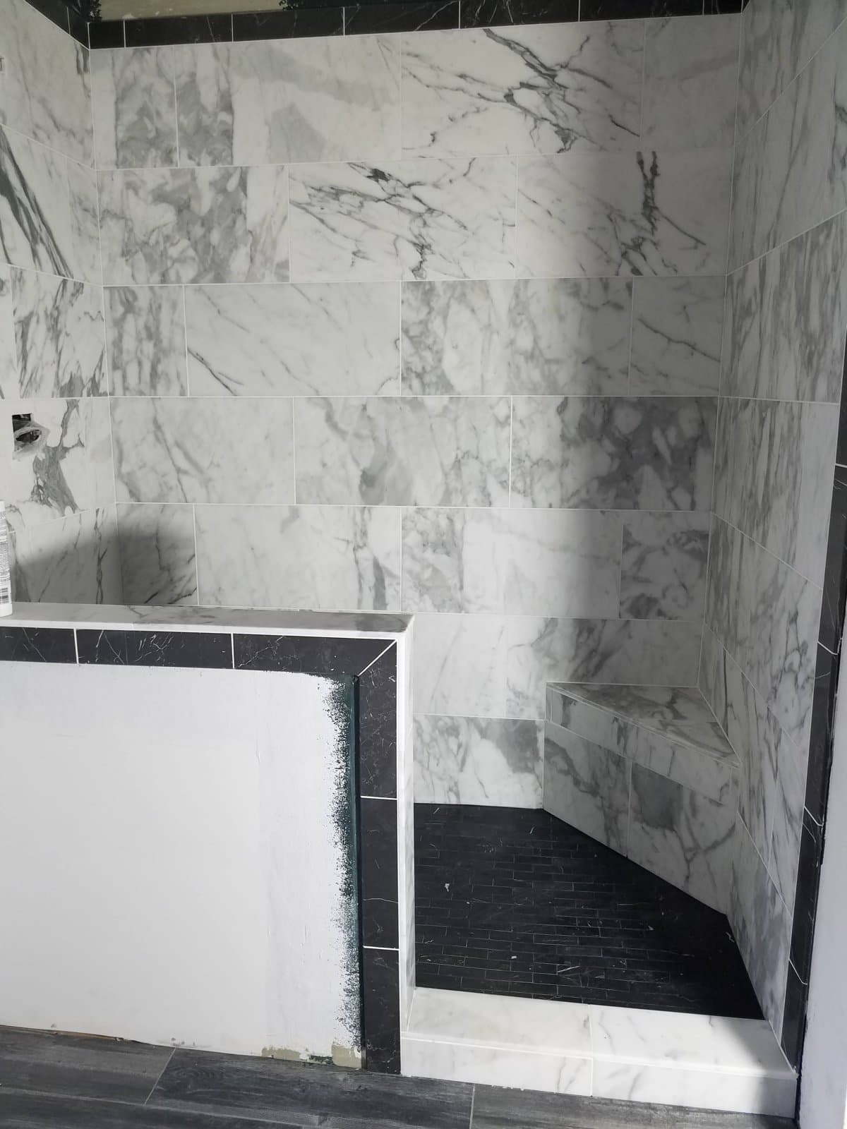 Finished shower, large-format marble-look tile, May 2020