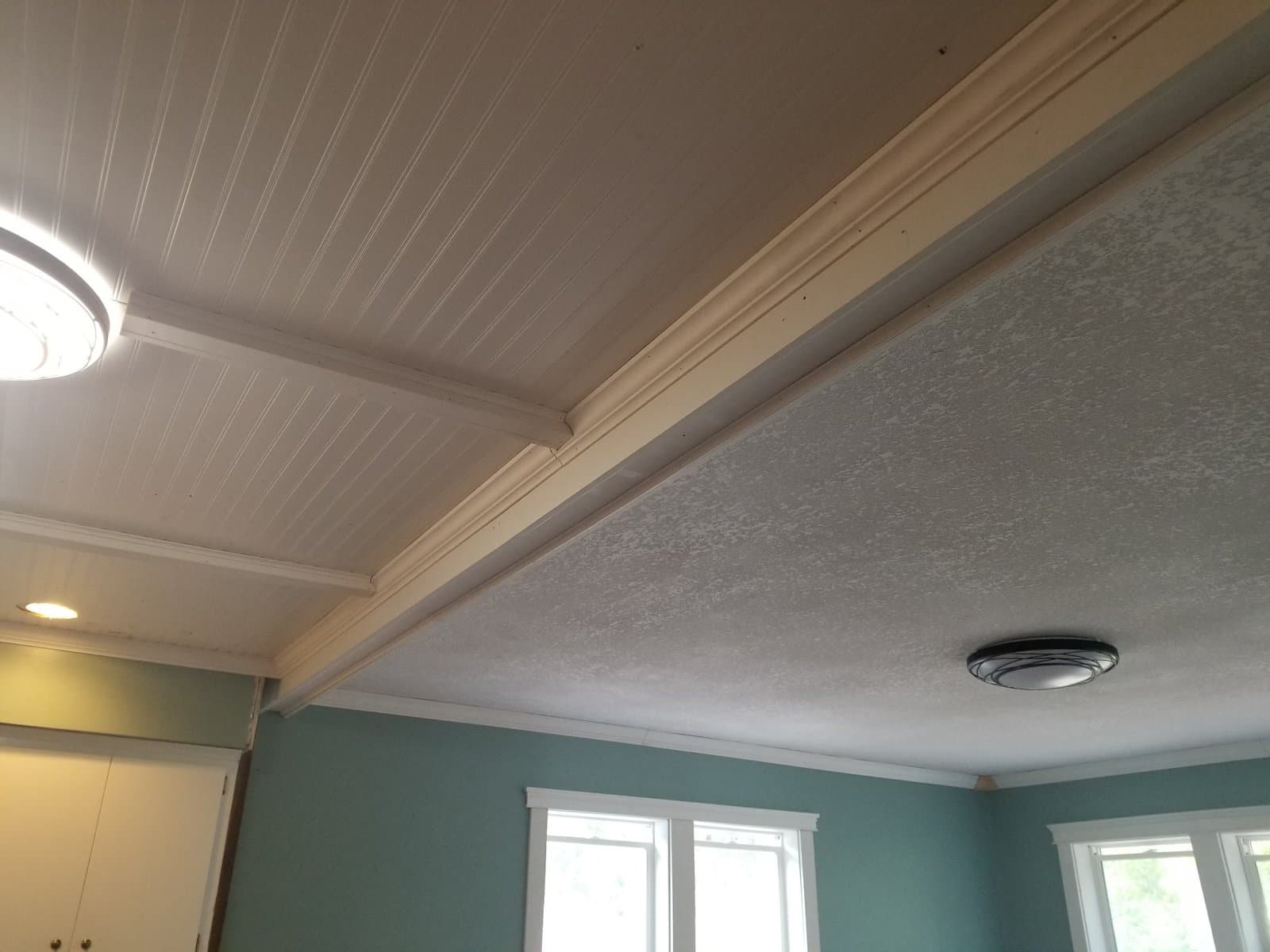 Beadboard coffered ceiling with the beams painted