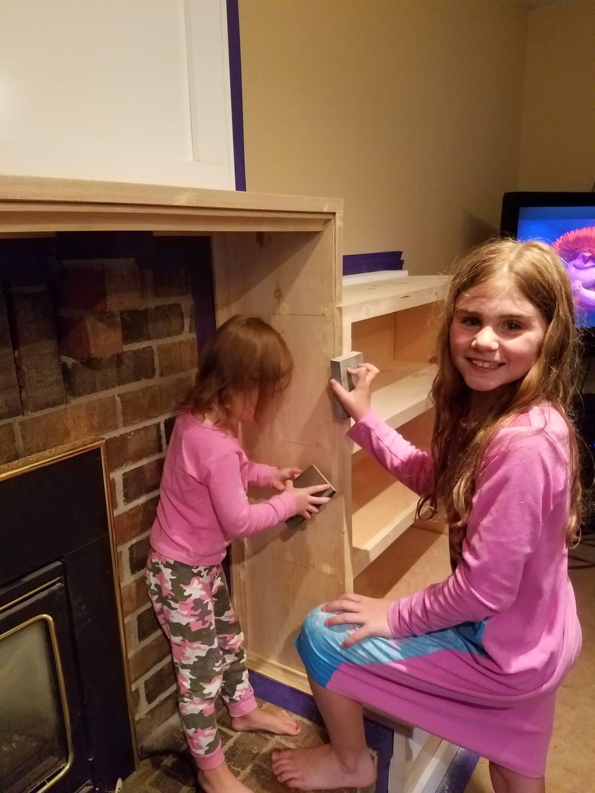 The girls painting the built-ins