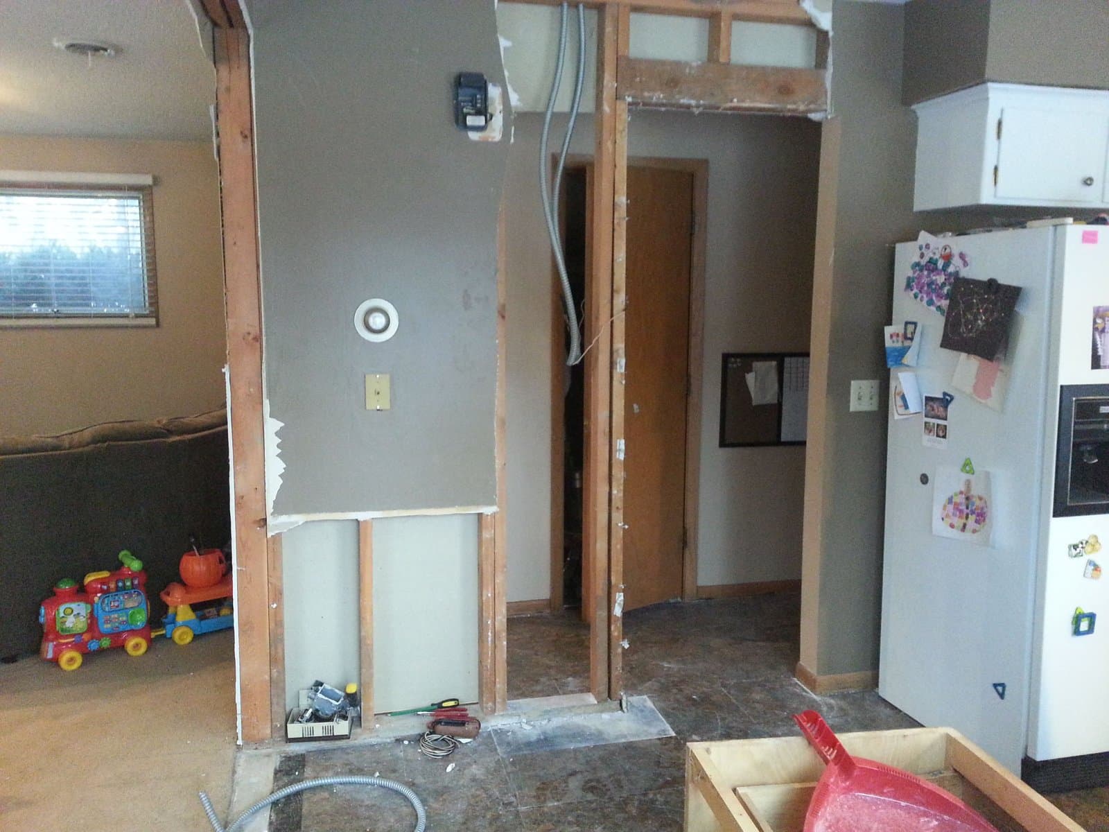 Header framed over the new opening to the kitchen