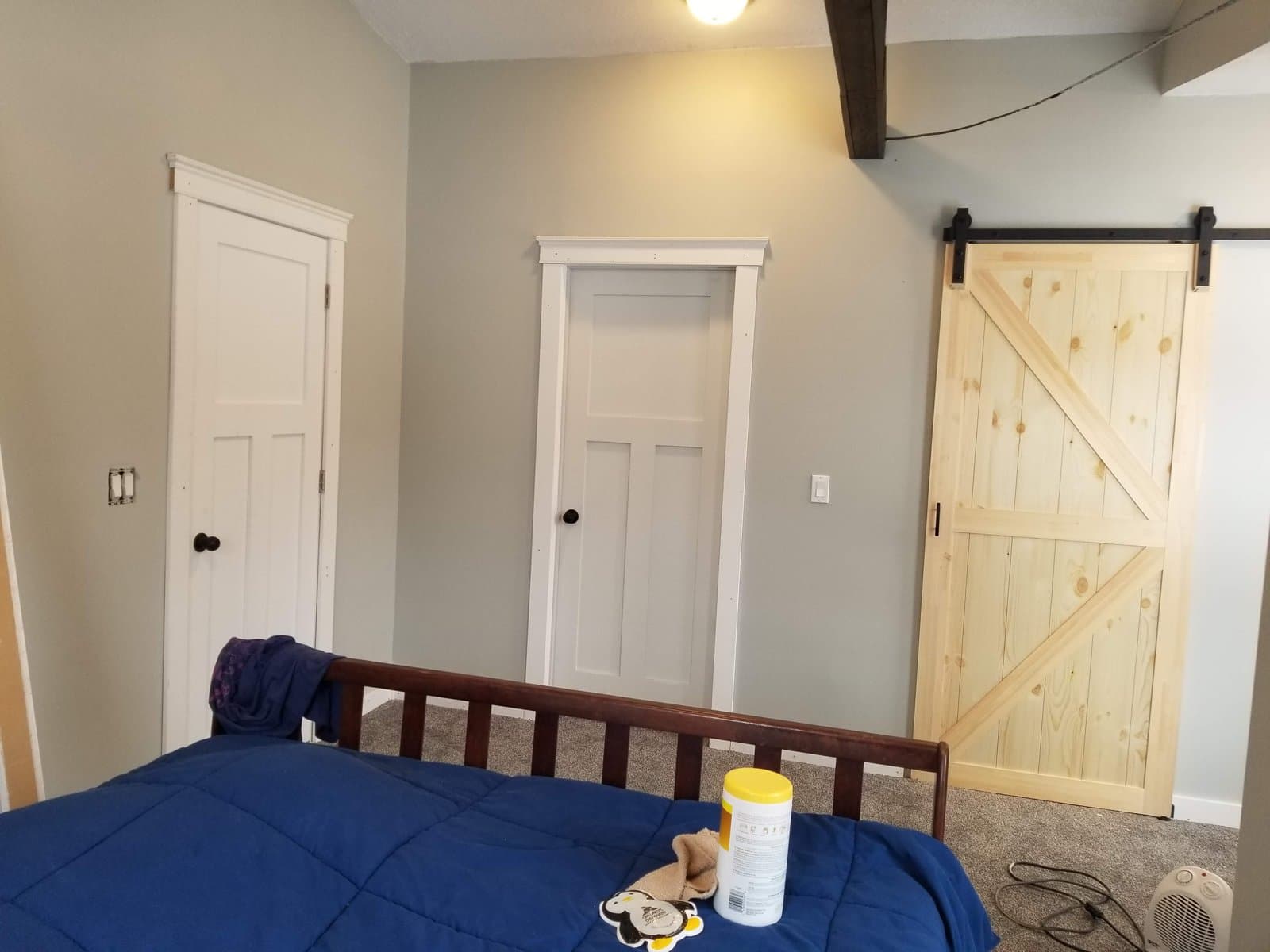 Barn door on the master bedroom, carpet down