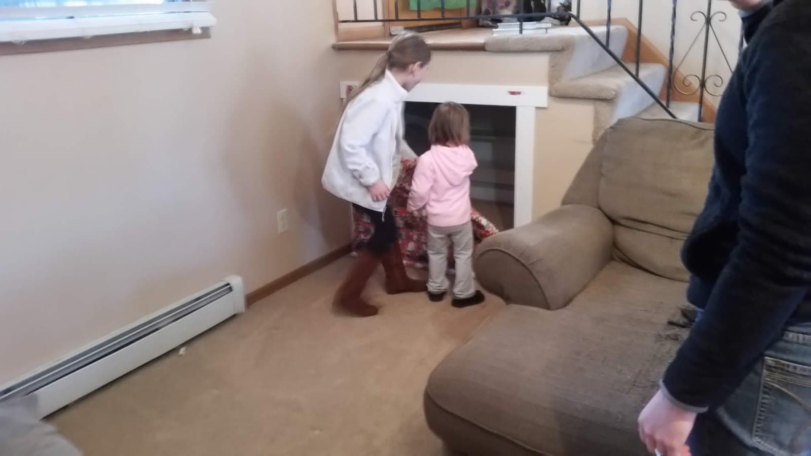 The girls tearing the paper off