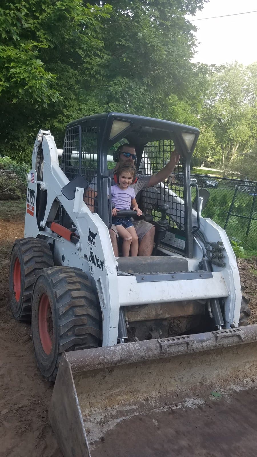Grading the yard afterward. Skid steer, one small operator.