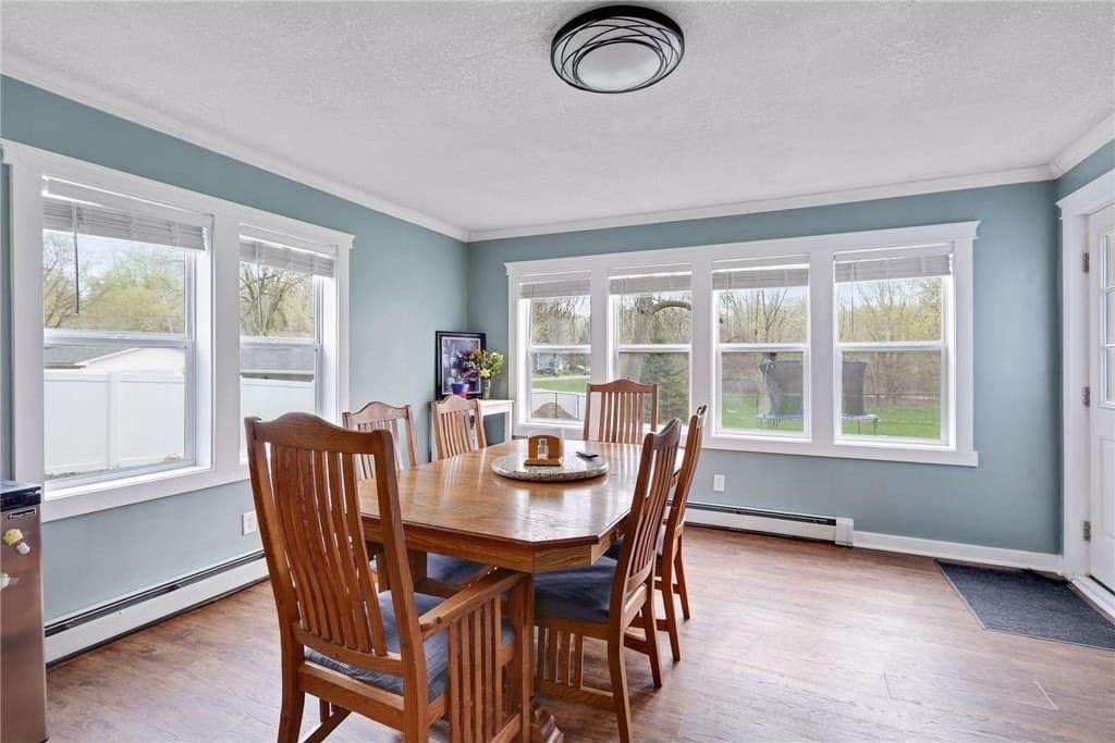 The dining room: coffered ceiling, wainscoting, the window wall