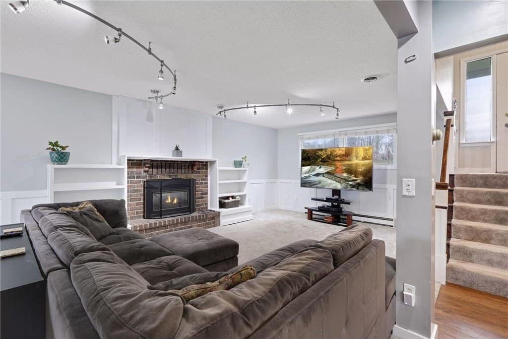 Family room: the fireplace built-ins and track lighting from 2018