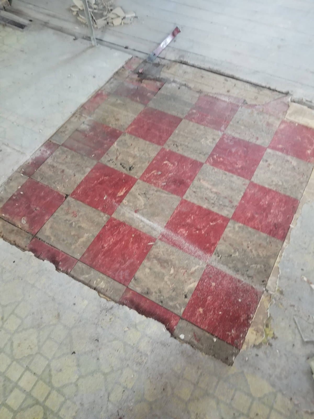 Red and cream checkerboard floor under the kitchen