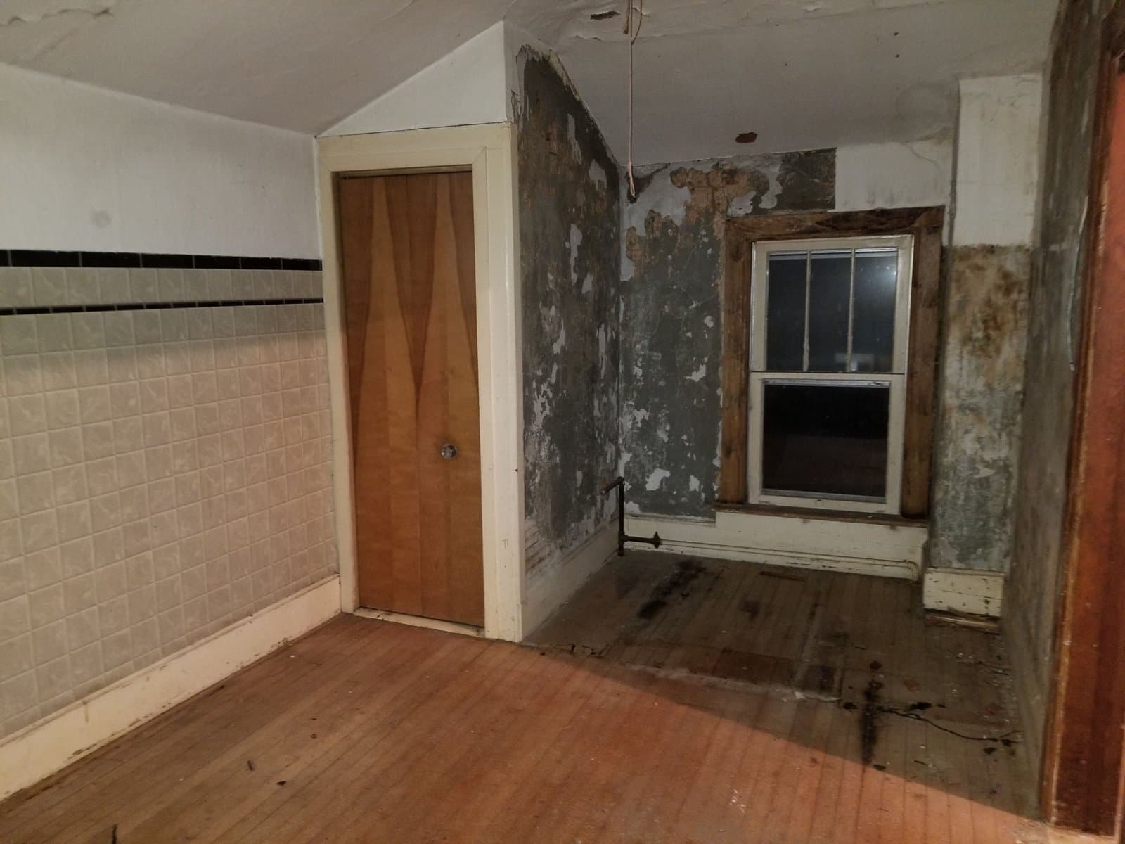 Upstairs, plaster failing off the lath
