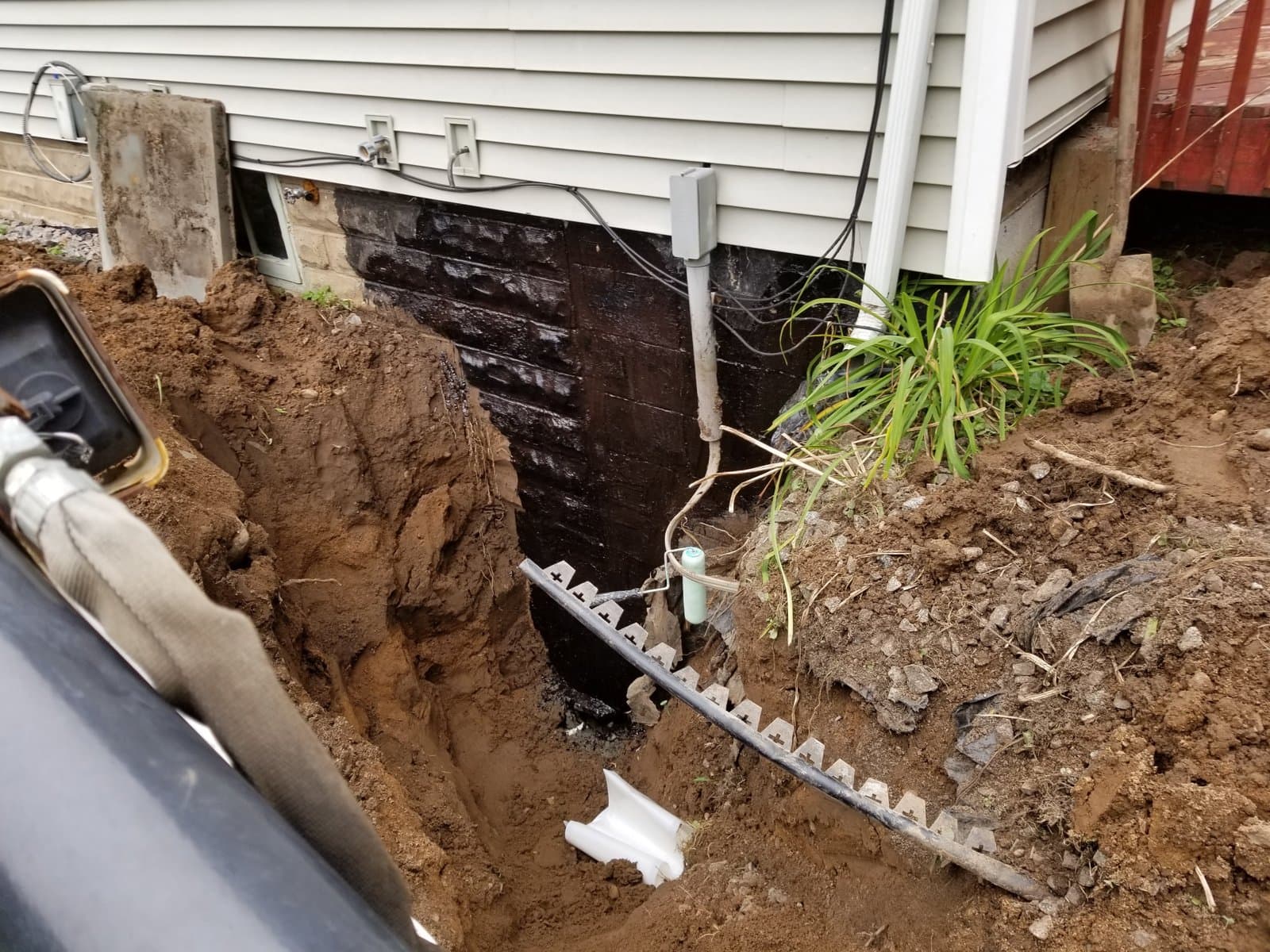 Foundation excavated to the footing along the side of the house