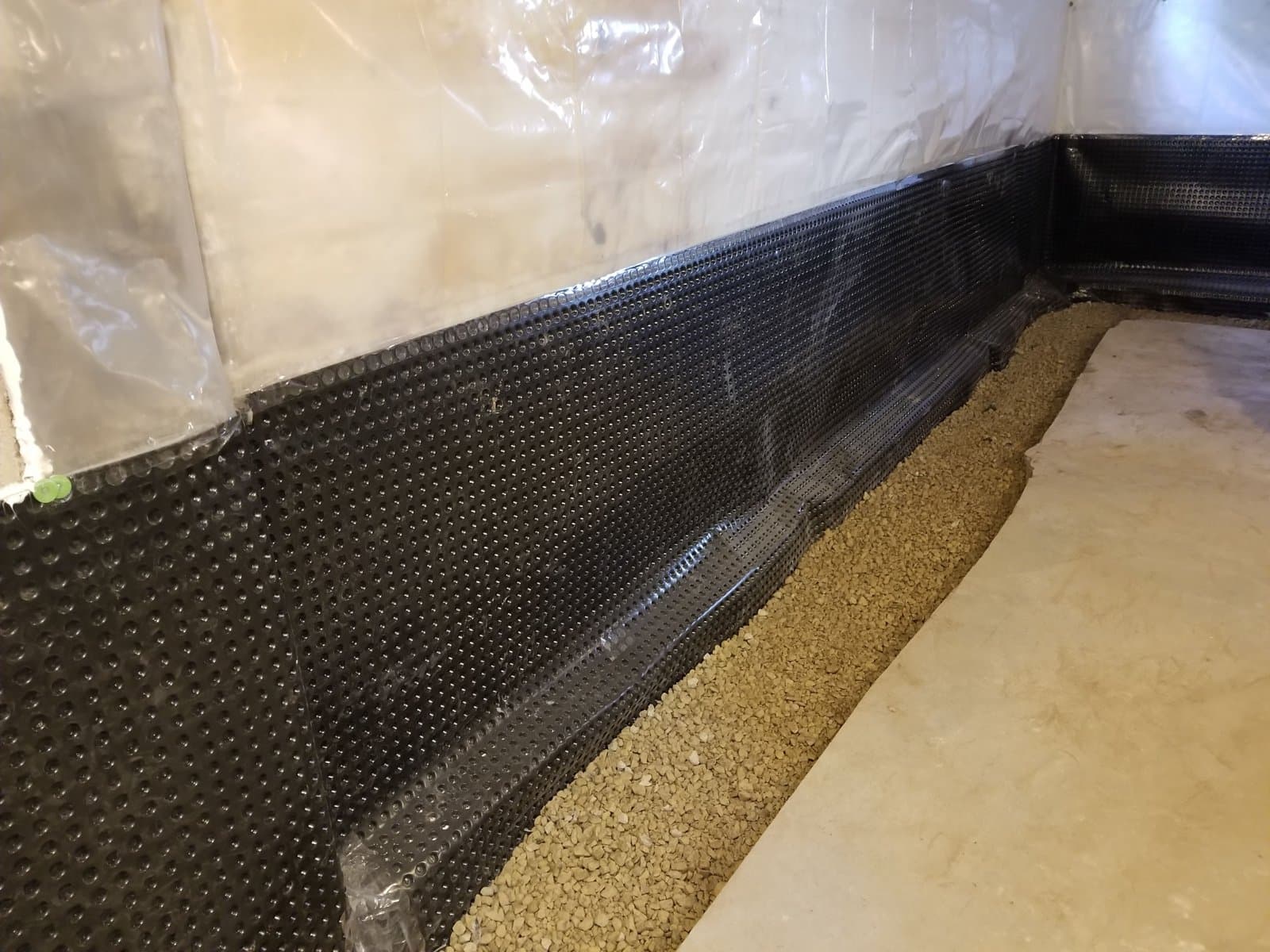 Tile covered in gravel, ready to pour back