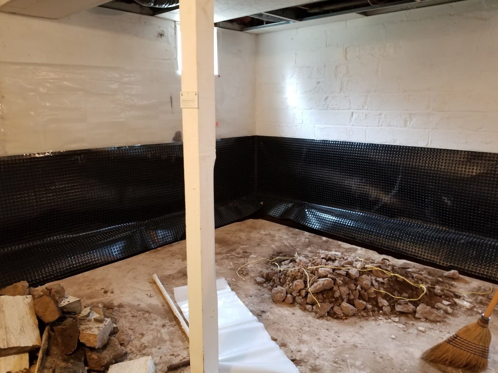 Dimple membrane up the wall, trench open
