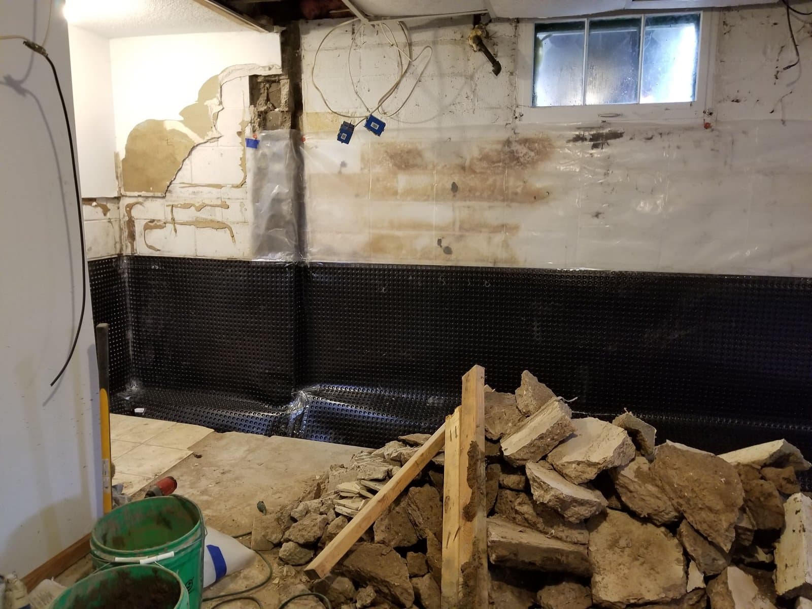 Slab cut and broken out along the wall