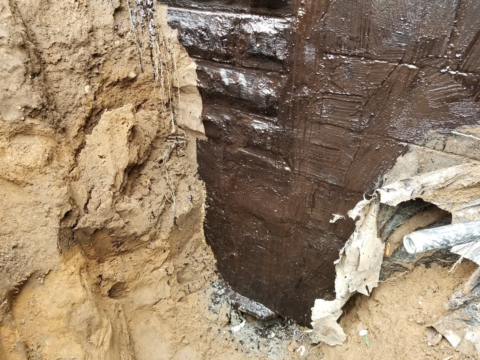 Wall cleaned and waterproofed before backfill
