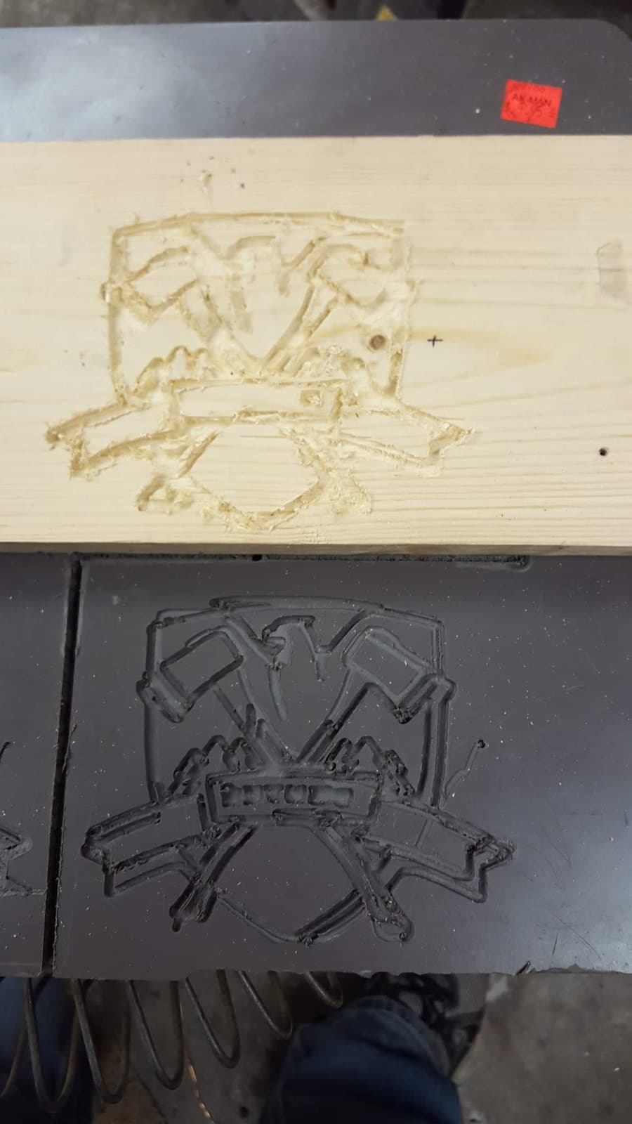 A carved outline in a wooden panel: it cut