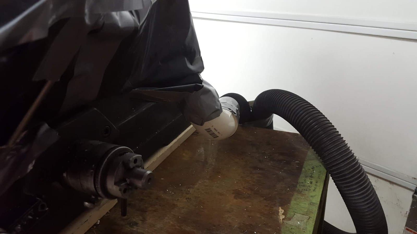 Shop-vac hose rigged to the spindle for chips