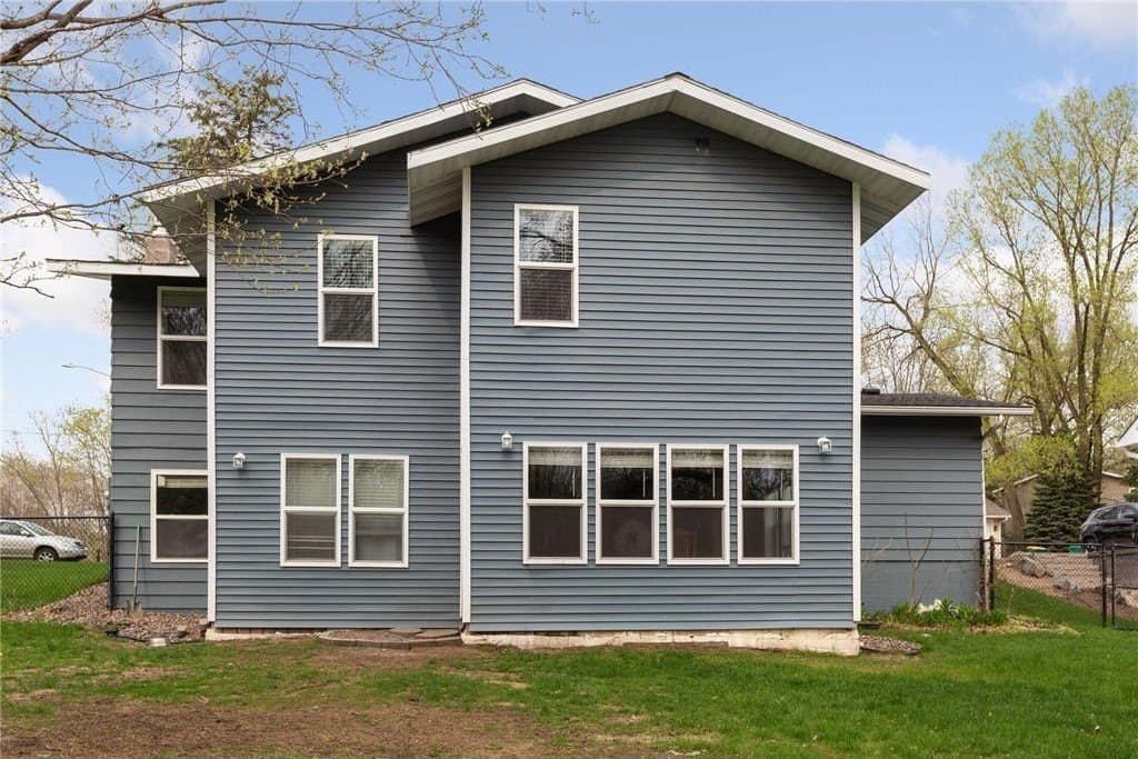 The finished house from the back yard, May 2022: the two-story addition on the left, the original split-level on the right, all one color